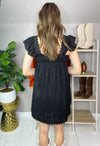 back of black embroidered J.Marie dress