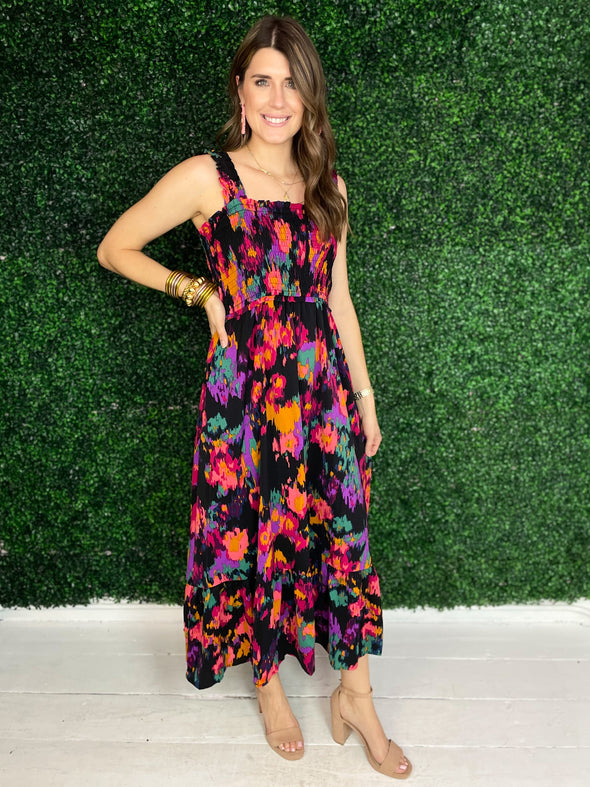 black maxi dress with multi colored pattern 