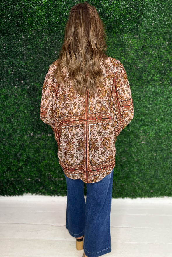back of neutral floral top 