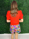 back of orange sweater top by thml 