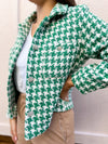 close up of rhinestone buttons on green houndstooth jacket