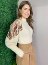 ivory sweater with sequin statement sleeve