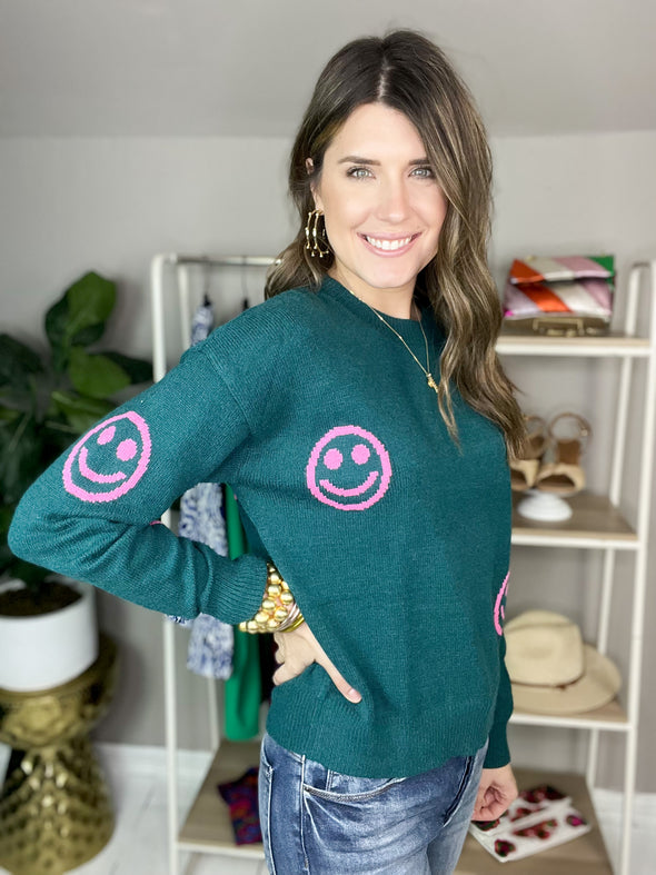teal sweater with smiley faces by THML 