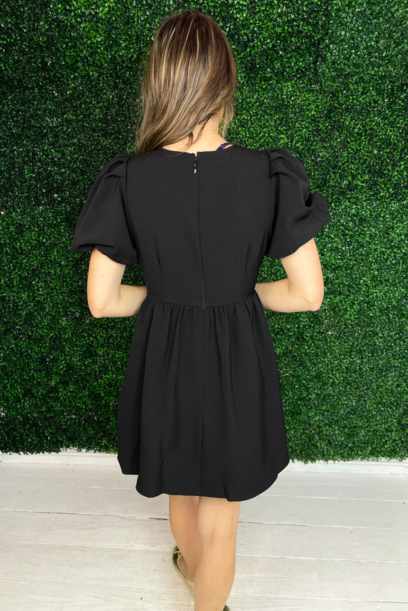 back of short black dress