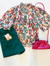 THML top with green shorts and pink purse 