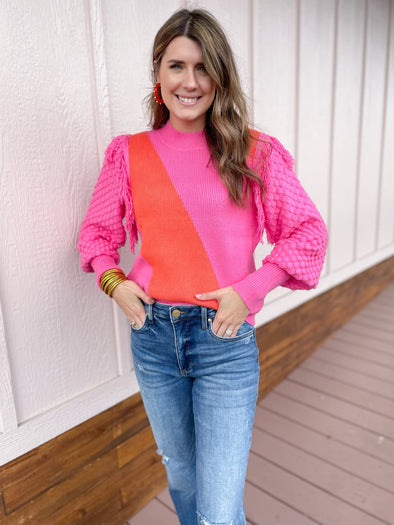 pink and orange fringe sweater 