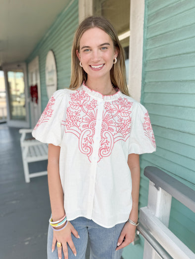 white top with coral embroidery 