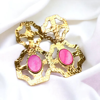 gold earring with neon pink stone 