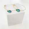 gold hoop earring with blue/green stone