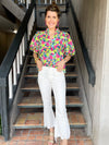 Teal, aqua, magenta, green THML top with puff sleeves and white denim pant 
