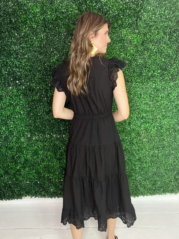 back of black midi dress
